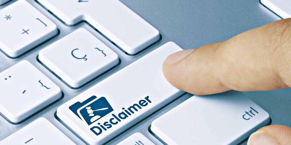 Finger pressing disclaimer key on computer keyboard